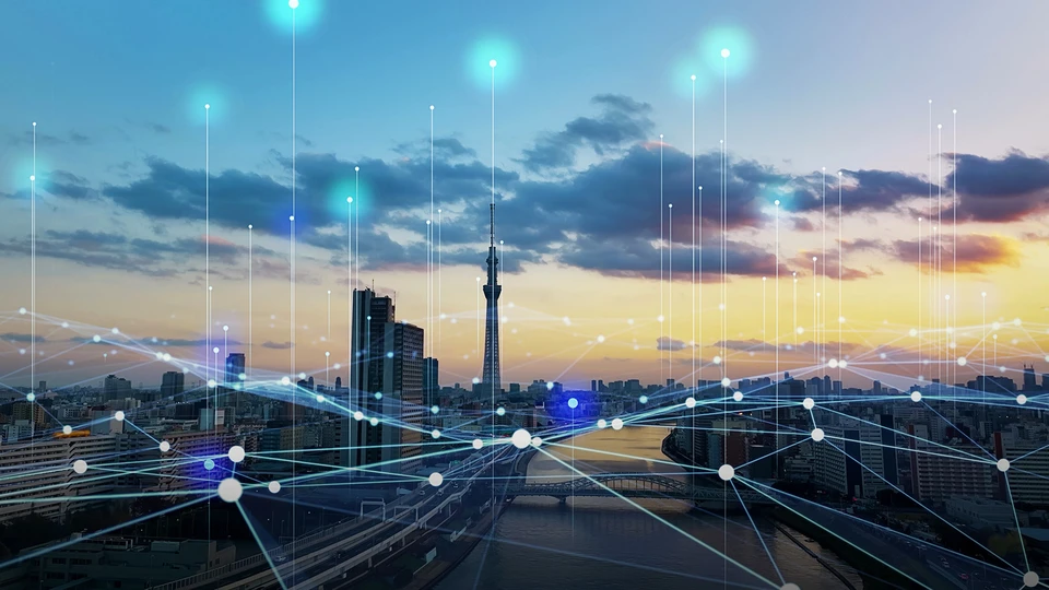 City Skyline at sunset with canal running through it with white dots on buildings and in sky connected by lines